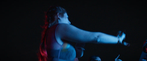 Friends dancing in the lights of an outdoor music festival