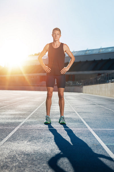Sprinter on race track in athletics stadium