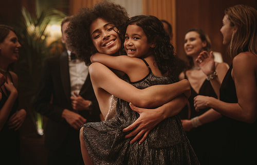 Mother and daughter having fun at a party