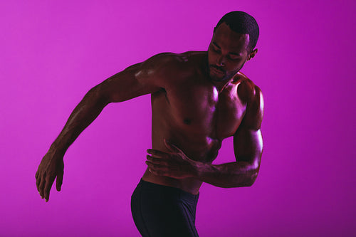 Bare chested muscular man working out