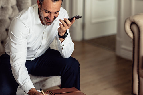 CEO on business trip working from hotel room