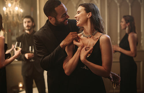 Cheerful couple a gala night party