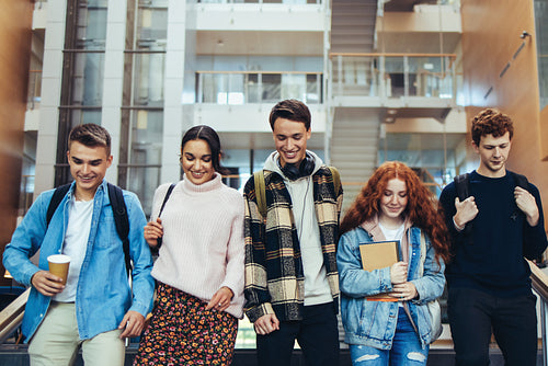 Group of students walking in college
