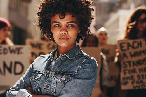 Woman protesting with group of activists 