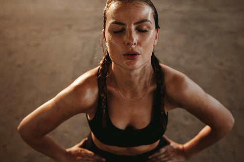 Woman taking break after intense workout