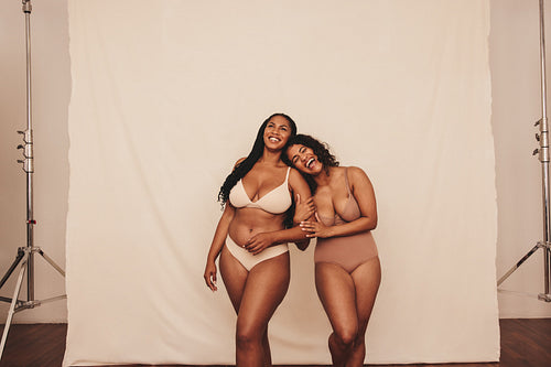 Two women loving being in their natural bodies