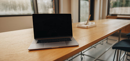 Blank laptop background in coworking space
