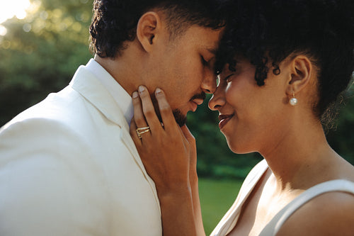 Tender moment shared between a newlywed couple on their special day