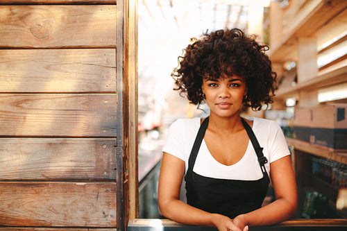 Portrait of young barista in coffee shop