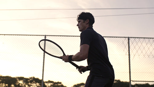Tennis player perfecting his forehands stroke