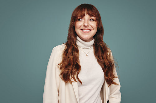 Woman smiling cheerfully in a studio
