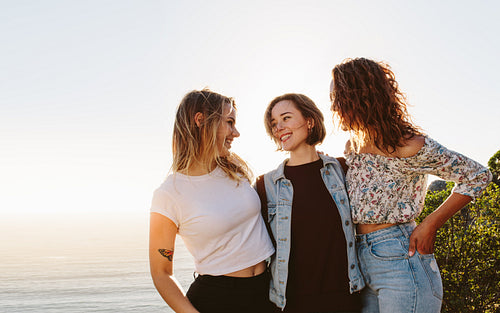 Smiling female friends enjoying on summer vacation