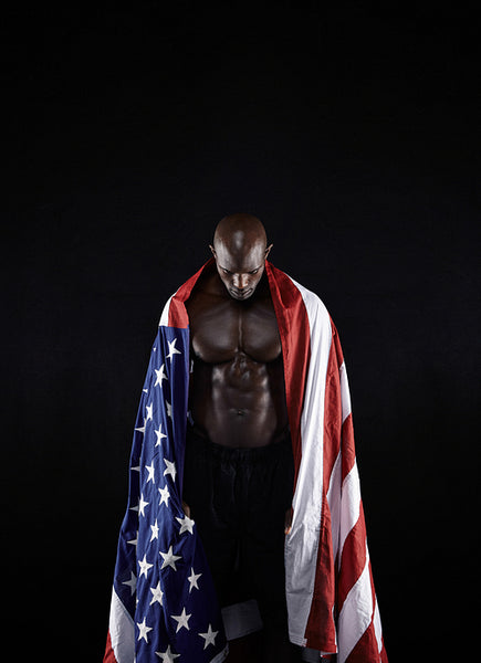 Shirtless muscular man with American flag