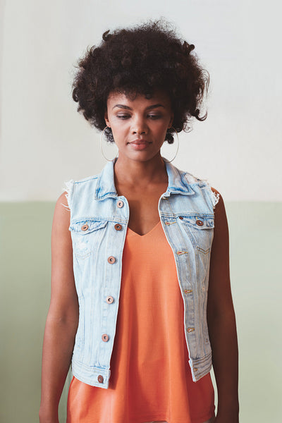 Attractive young woman standing alone