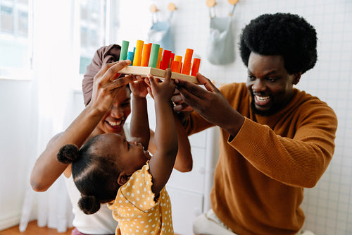 Family playing with colorful blocks