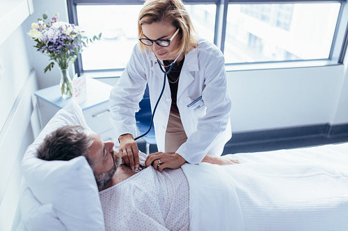 Doctor attending male patient for routine checkup
