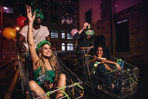 Multi-ethnic friends celebrate St.Patrick's day at night