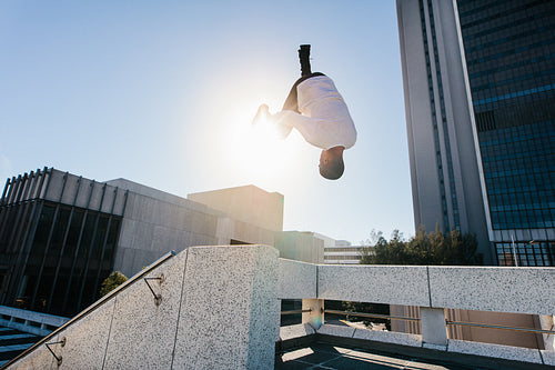 Man outdoors practicing parkour