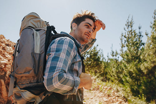 Man exploring nature walking through mountain trails