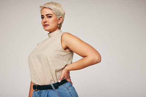 Blonde-haired woman looking at the camera confidently