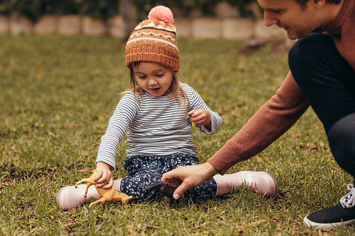 Father and daughter playing in park