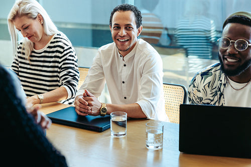 Group of professionals having a meeting around a boardroom table