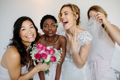 Cheerful bridesmaids with the bride on wedding day