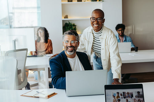 Modern office teamwork with happy colleagues planning and smiling