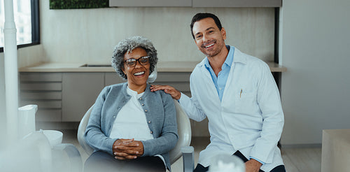 Senior patient with dentist during dental consultation in a modern clinic