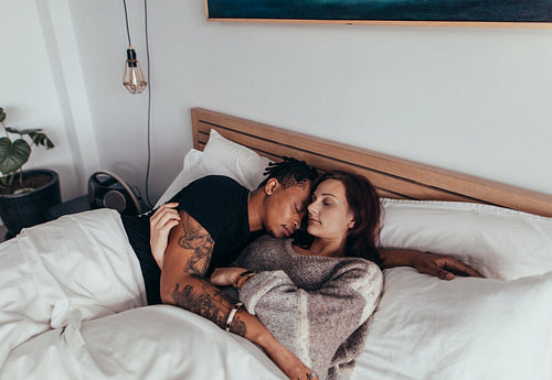 Couple sleeping peacefully on the bed