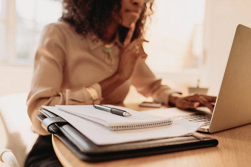 Businesswoman working from home on laptop