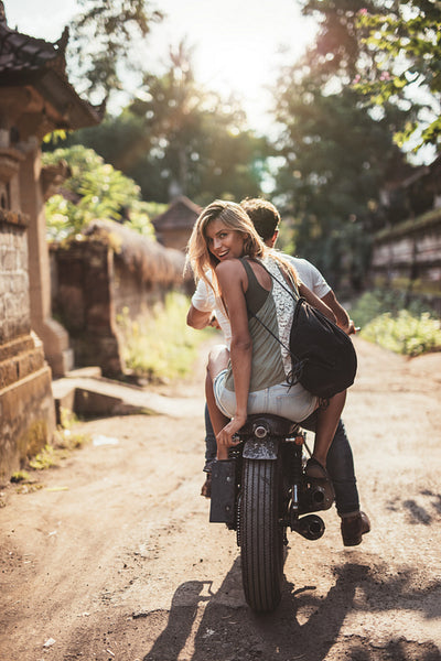 Young couple riding motorcycle