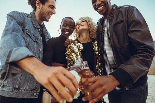 Friends having beers at the beach
