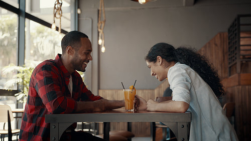 Beautiful couple in love at a cafe
