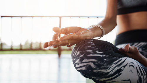 Woman meditating in the lotus position