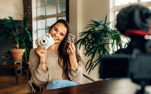 Female blogger showcasing her content on camera