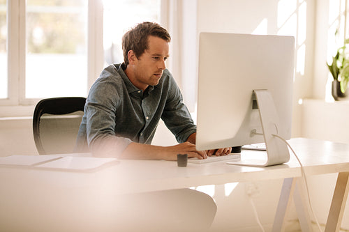 Entrepreneur working on computer at home