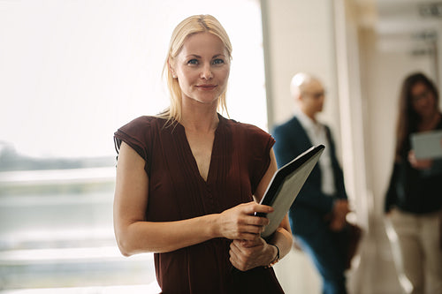 Confident business woman standing in office