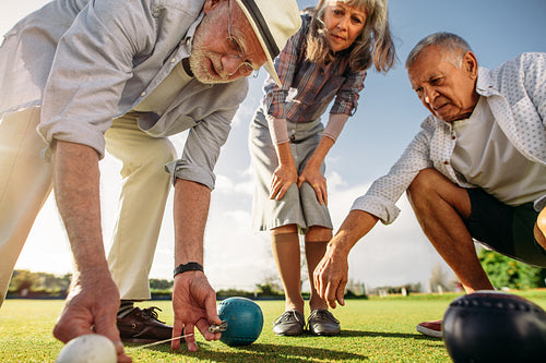 Close up of senior people checking the result of the game