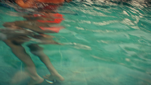 Happy family enjoys a relaxing and fun vacation day splashing in a luxury villa pool