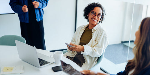 Casual business meeting with smiling diverse team