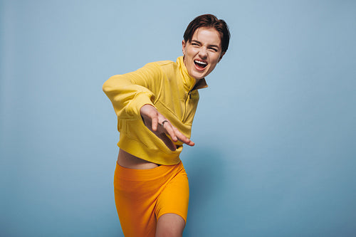 Woman doing fun dance moves in a studio