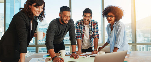 Man discussing new designs and color scheme with colleagues