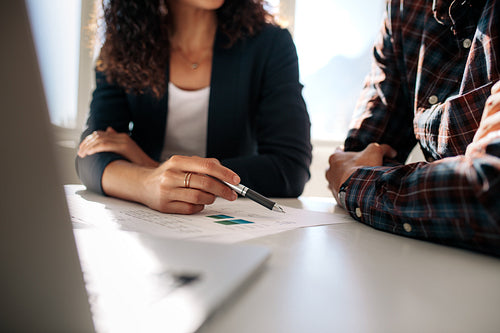 Business colleagues discussing work at office