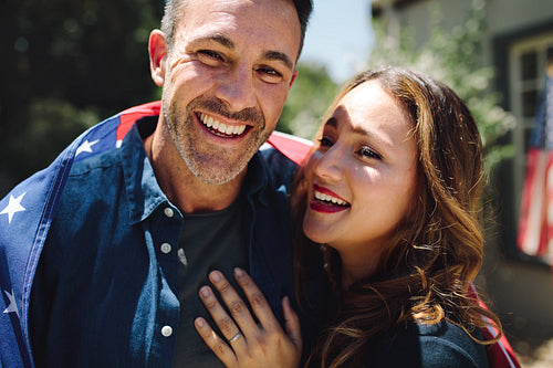 Close up of a smiling couple standing together