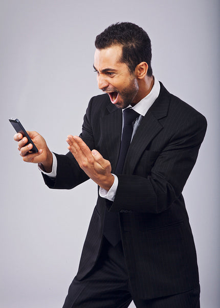 Businessman Screaming in Excitement While Reading SMS