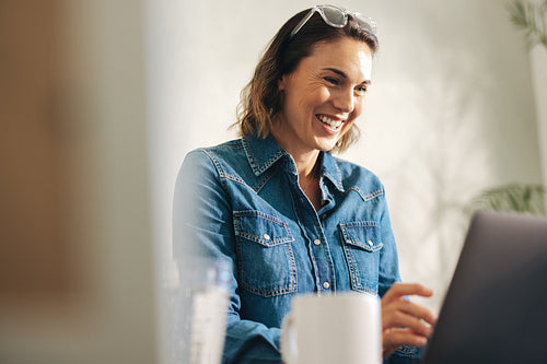 Confident and successful businesswoman working with a laptop