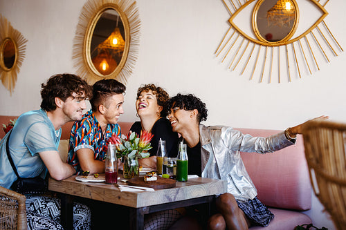 Queer friends laughing together