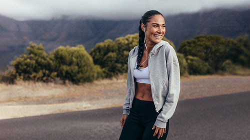 Cheerful fitness woman on morning workout