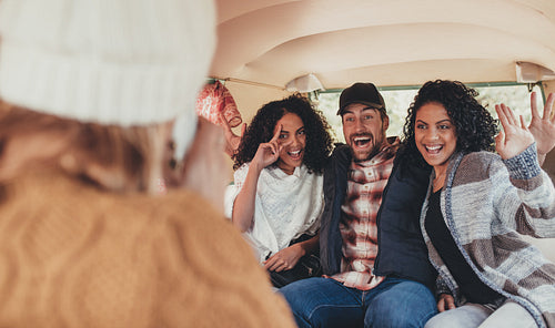 Crazy friends on road trip taking pictures